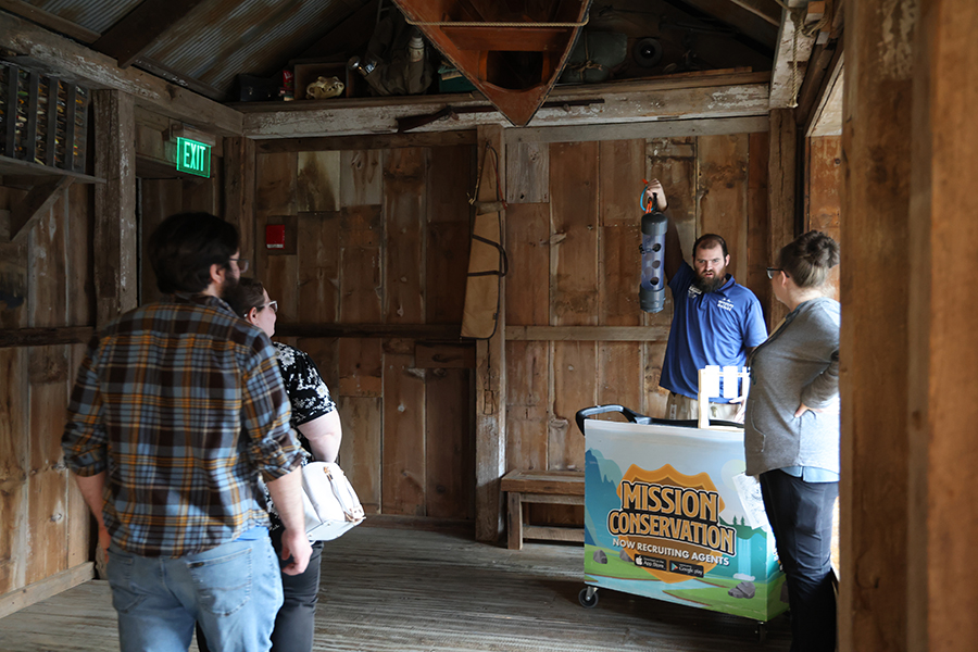 A staff member gives onlooking guests a demonstration.